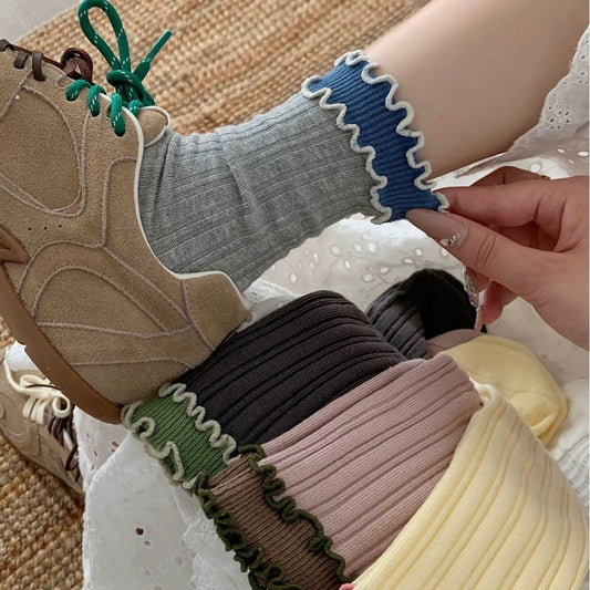Close-up of Rufia long socks showing wave trim detail