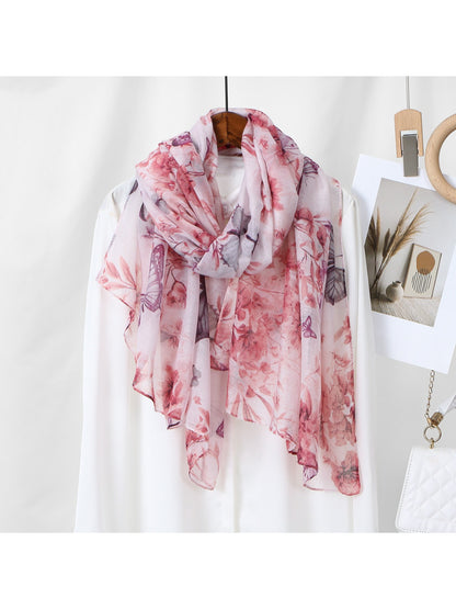 Scarvii lightweight scarf folded showing colorful butterfly and floral design