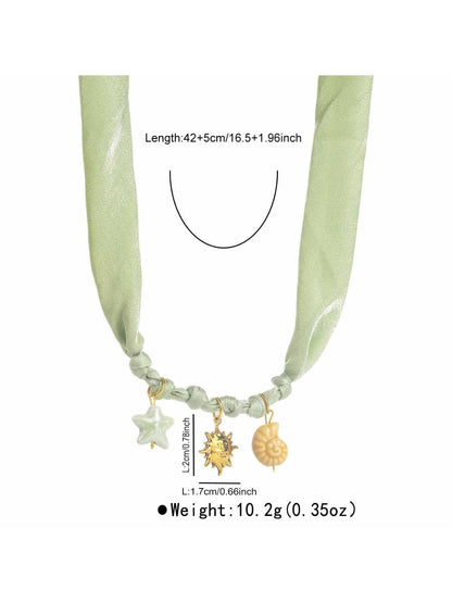 Neckit Summer Charm fabric necklace worn on a model's neck with summer outfit