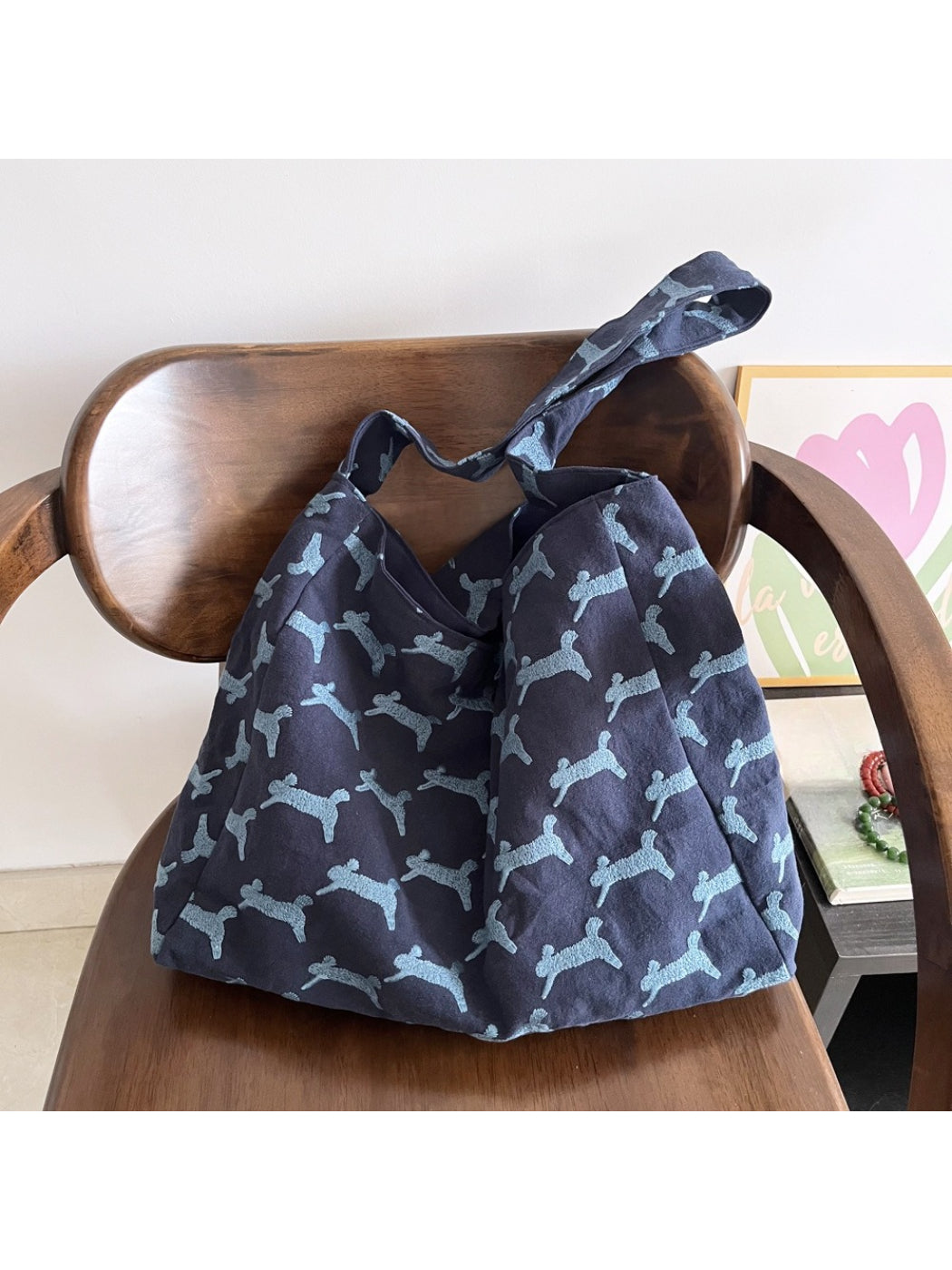 Side view of Cosbai oversized hobo bag showing shape and handle