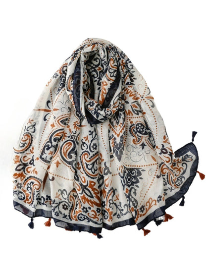 Ornate paisley tassel scarf folded showing detailed pattern and vibrant colors
