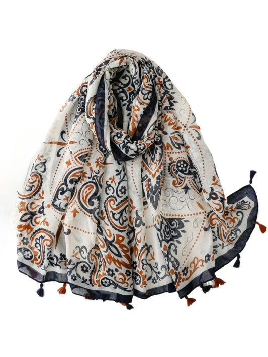 Ornate paisley tassel scarf folded showing detailed pattern and vibrant colors