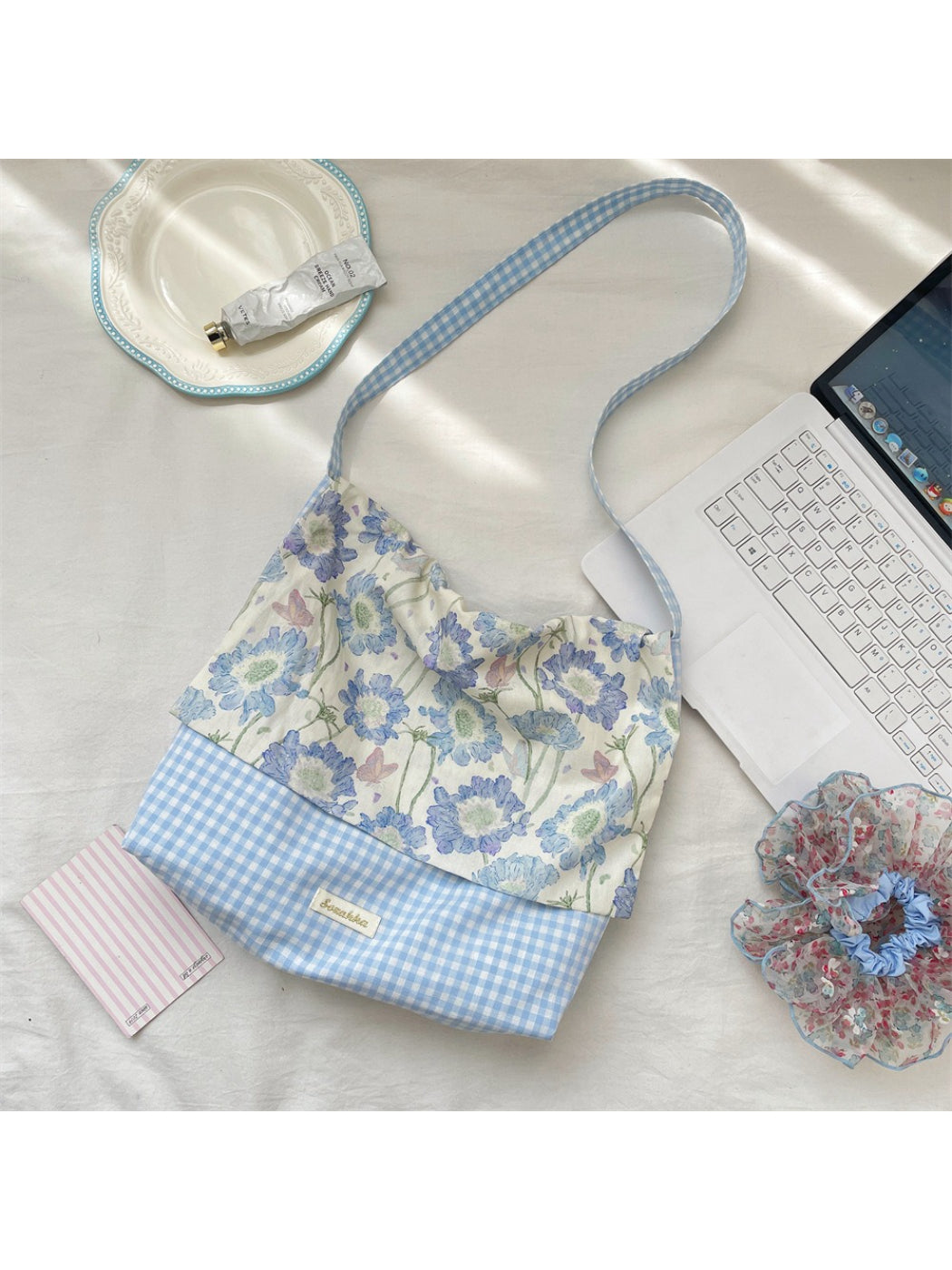 Cosbai tote bag open to display spacious interior with gingham and floral design
