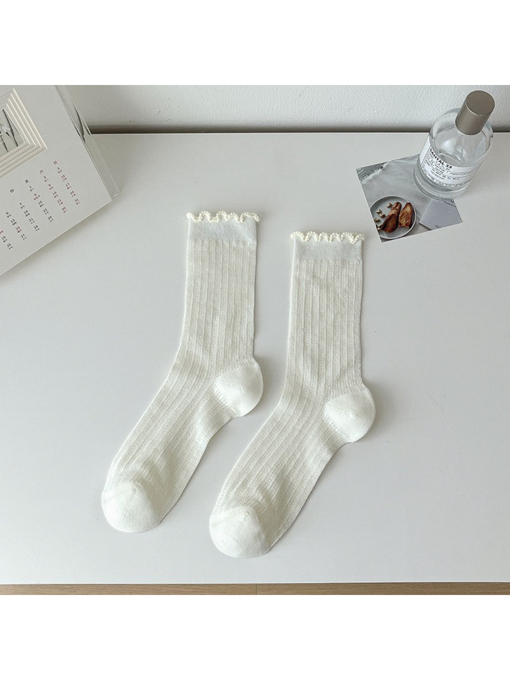 Rufia lace white mid-calf socks styled with casual footwear