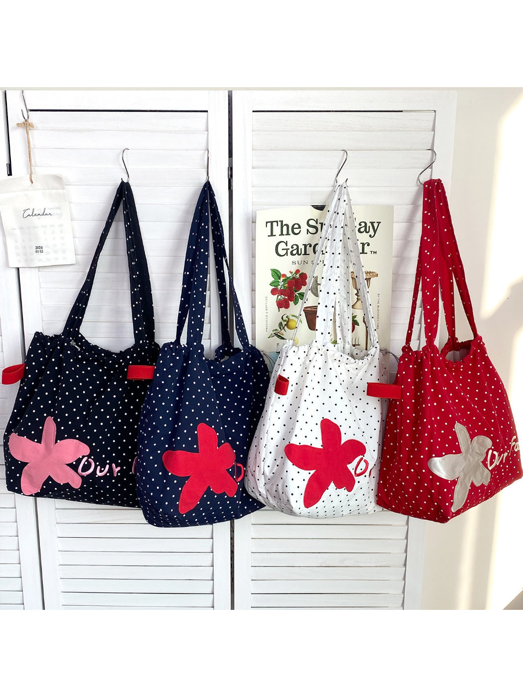 Close-up of floral patch embroidery detail on Cosbai slouchy shoulder bag