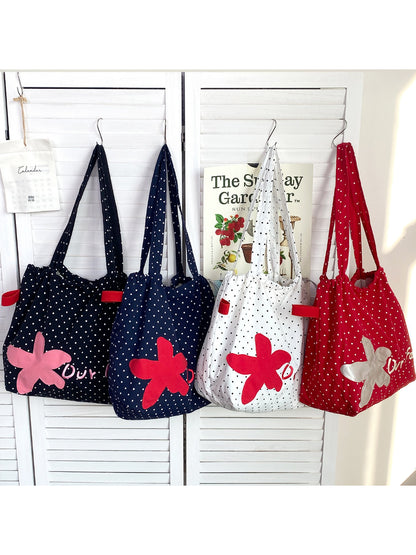 Close-up of floral patch embroidery detail on Cosbai slouchy shoulder bag