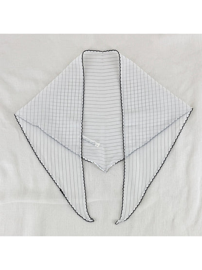 Scarvii triangle scarf folded to show pleats and black contrast edging