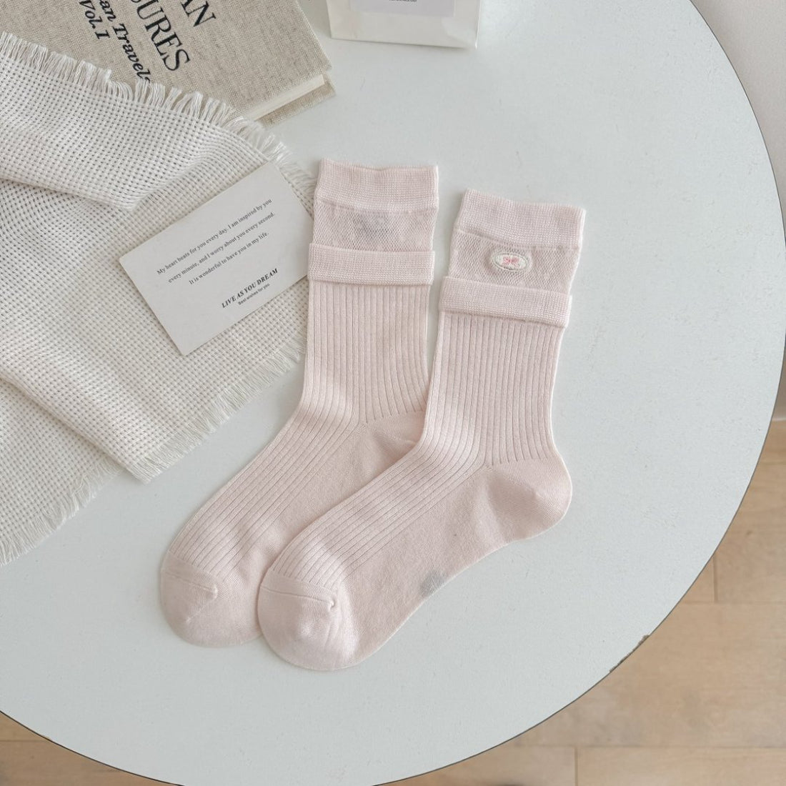 Close-up of Rufia sock heel and toe stitching in beige color