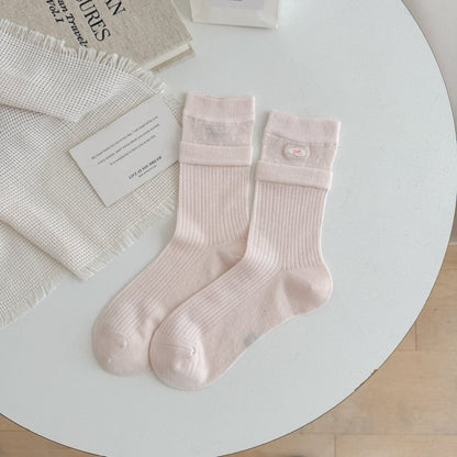 Close-up of Rufia sock heel and toe stitching in beige color
