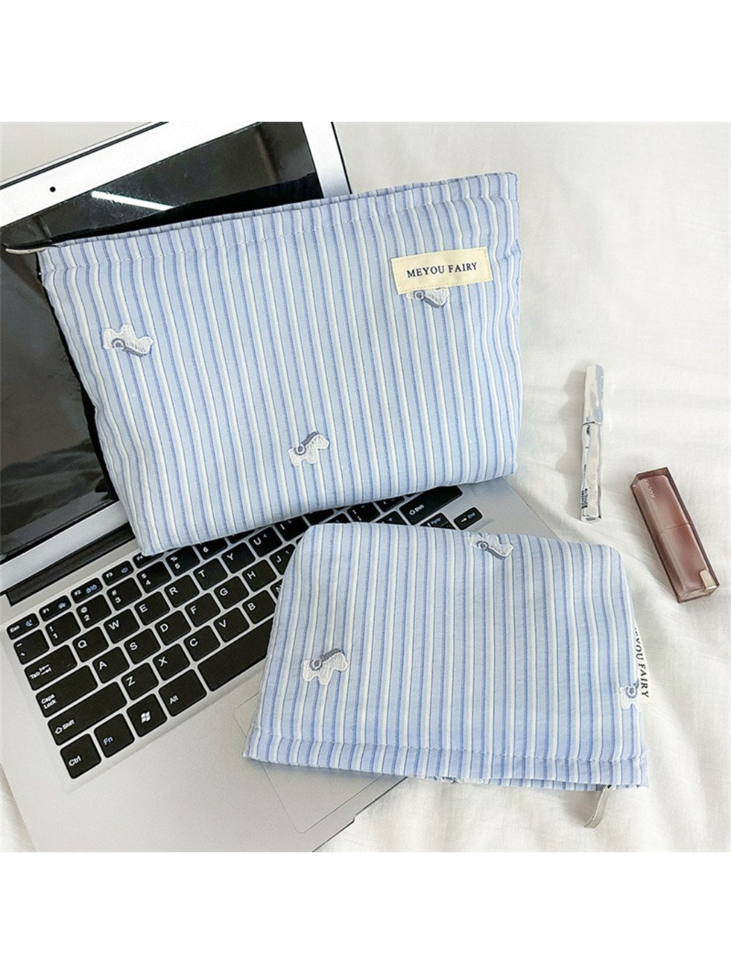 Close-up of Cosbai Soft Stripe Makeup Pouch and fabric texture