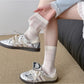 Close-up of Rufia neutral textured crew sock fabric highlighting knit pattern