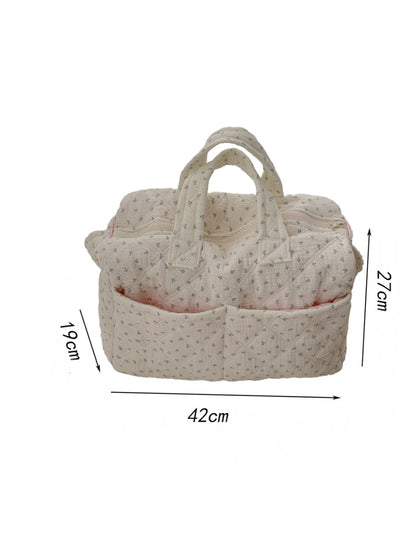 Cosbai padded floral travel bag displayed on flat surface
