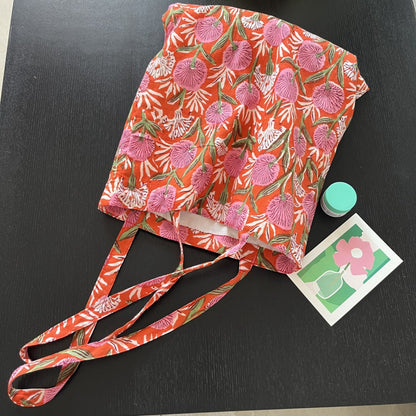 Cosbai Warm Floral Carryall Tote held by model showcasing size and handle length