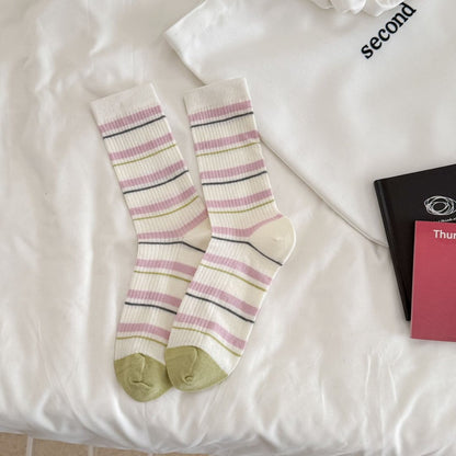 Rufia ribbed socks displayed with packaging showing brand and stripe colors