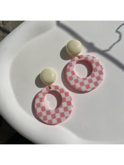 Earwish Retro Check Hoop Earrings with black and white check pattern, close-up view