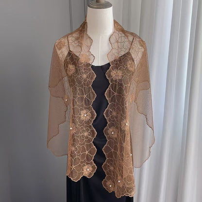 Scarvii scarf laid flat highlighting intricate floral lace pattern and pearls