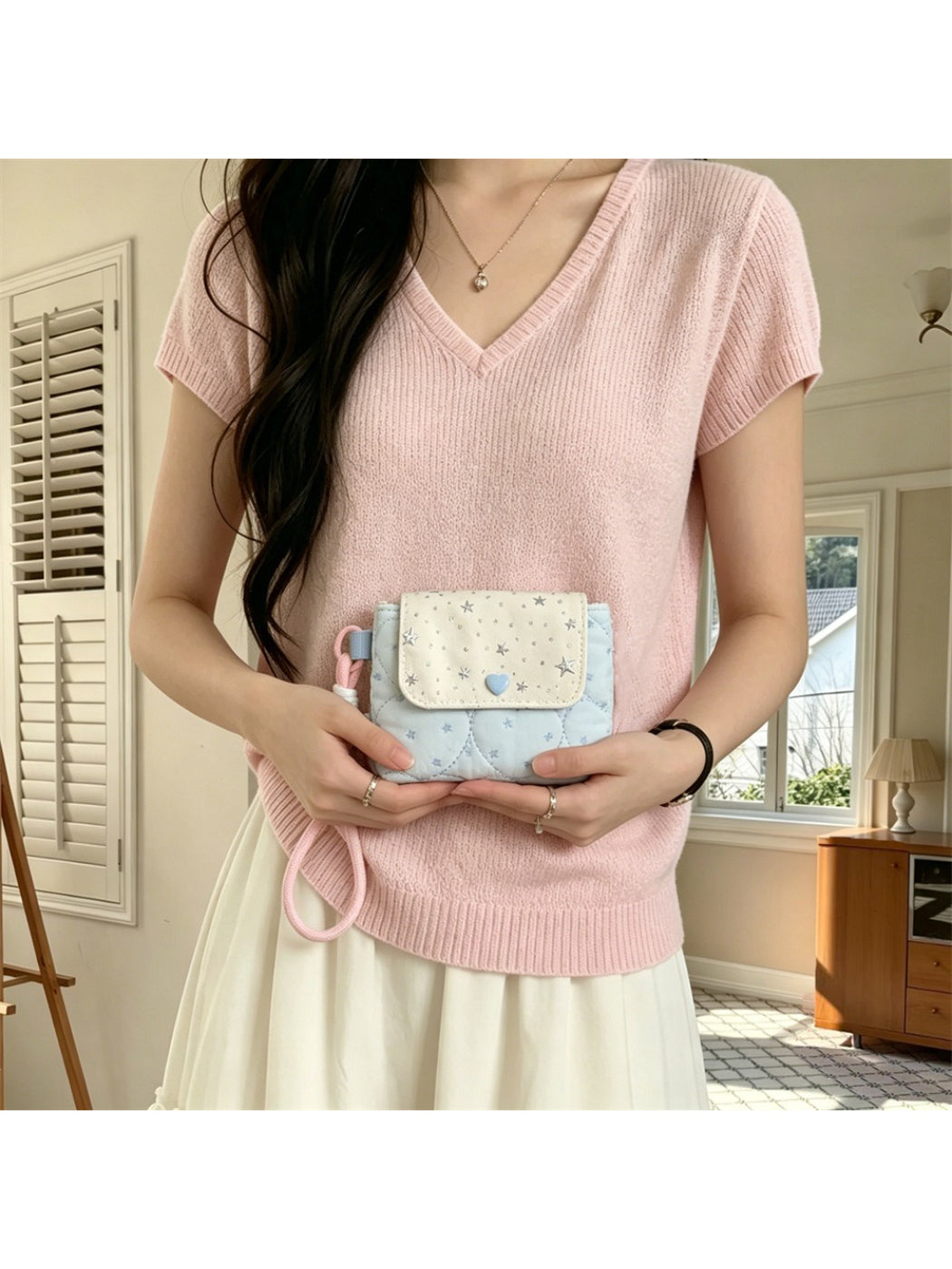 Cosbai quilted star mini wrist pouch partially open on a flat surface