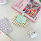 Side view of Cosbai mini polka dot pouch bag highlighting slim profile