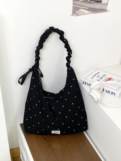 Cosbai ruched strap slouchy shoulder bag worn over shoulder by model