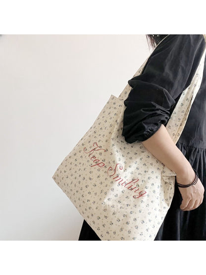 Cosbai vintage floral tote bag with colorful flower print and lettering on beige fabric