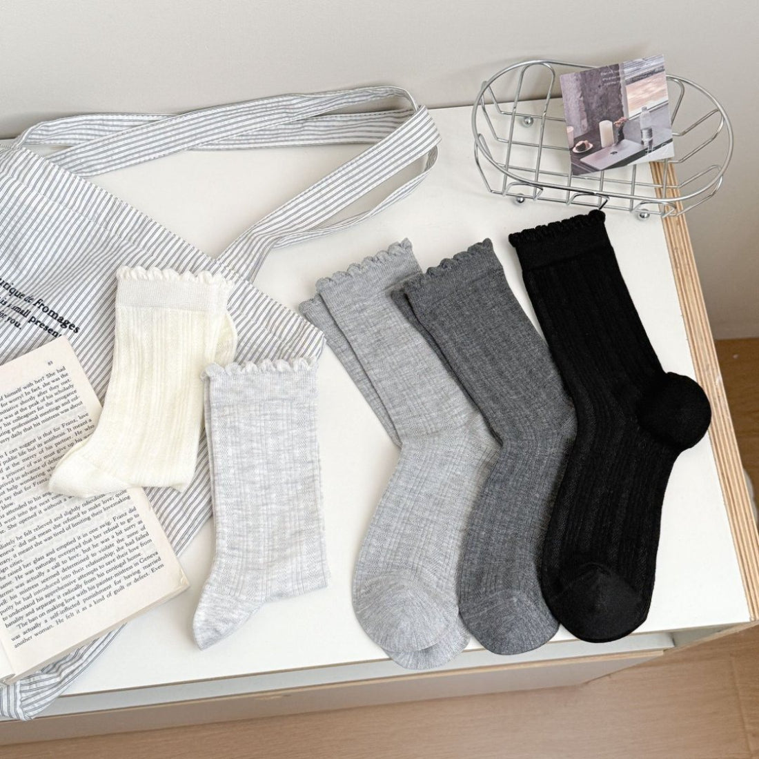 White crew socks with ruffle trim displayed flat