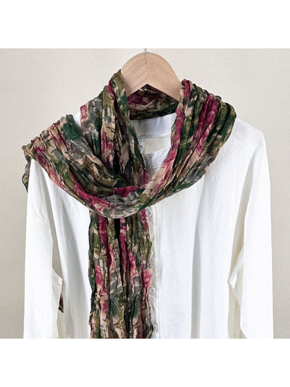 Close-up of Scarvii scarf fabric showing detailed painterly texture and color blending