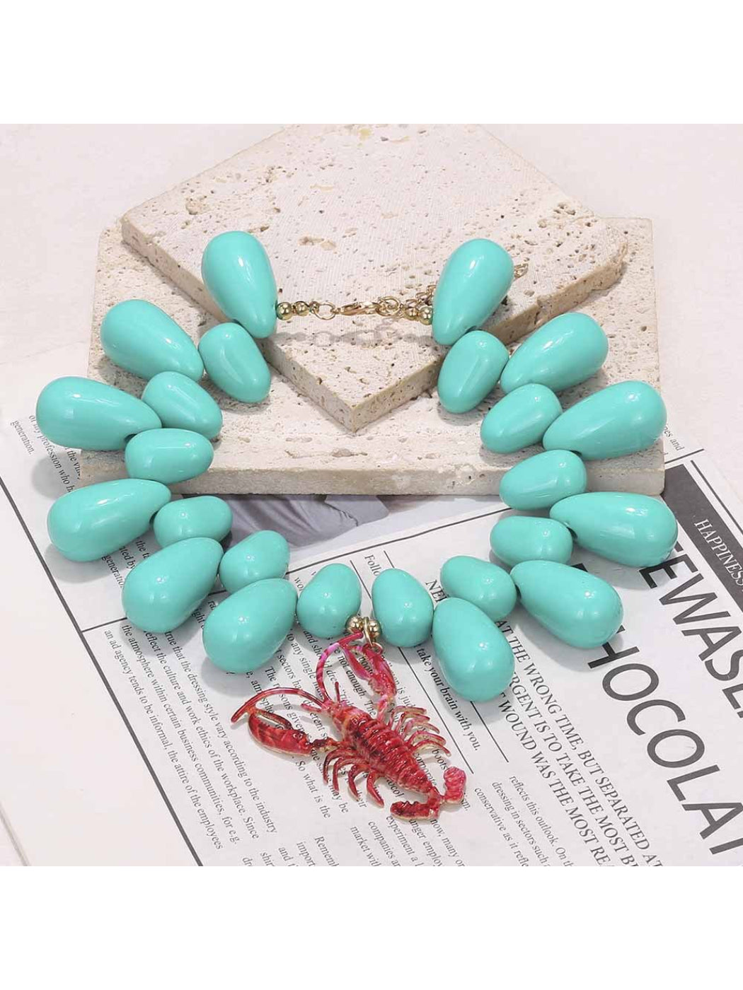 Neckit statement bead necklace with lobster pendant displayed flat showing full length