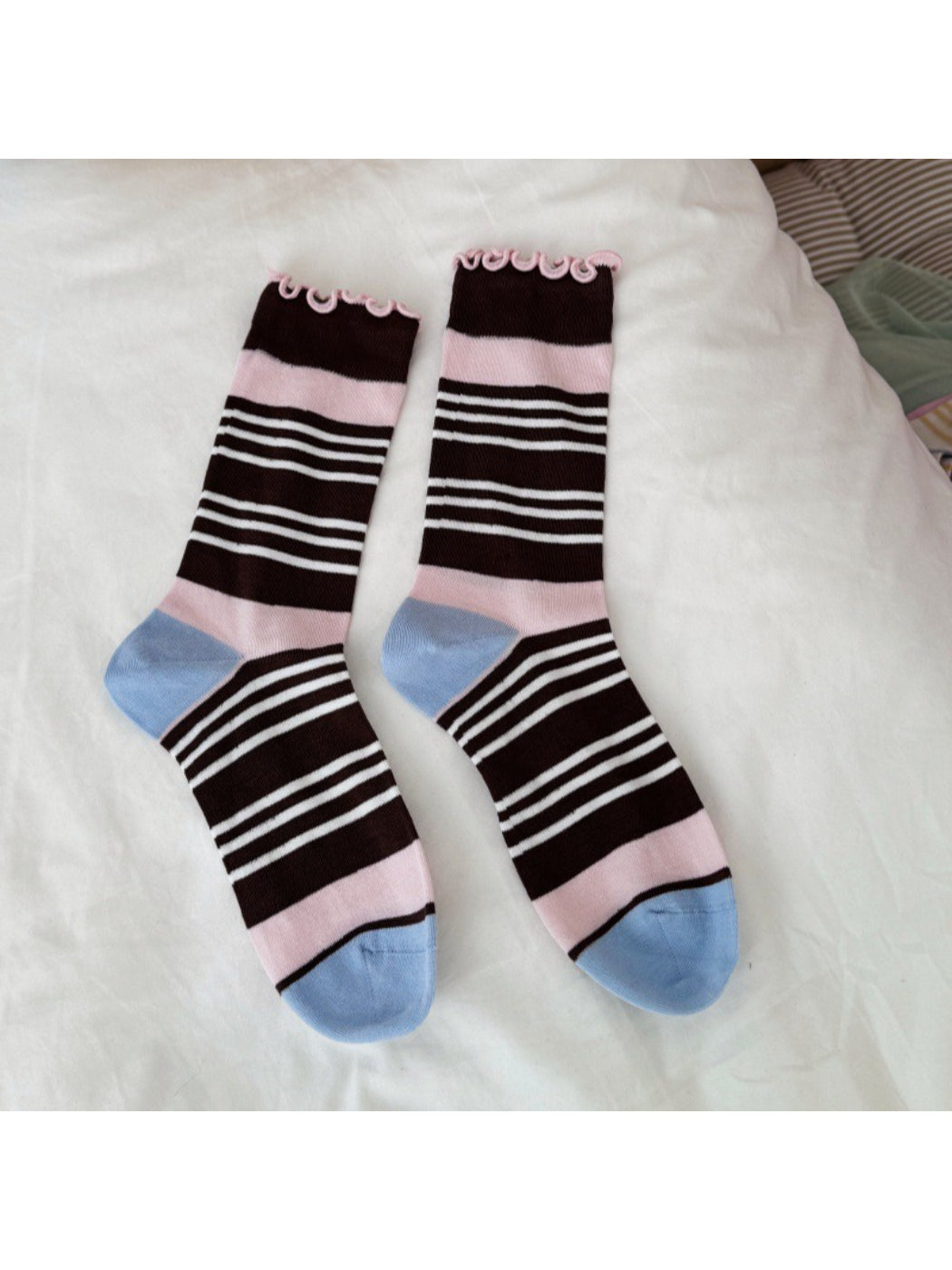 Close-up of the fabric texture and stripe colors on Rufia socks