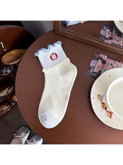 Rufia lace ruffle ankle socks displayed with soft lighting emphasizing lace details