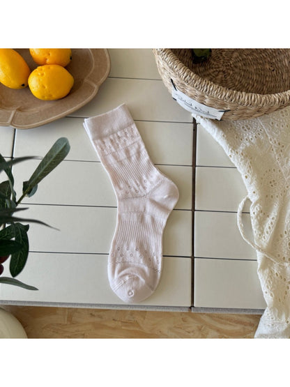 Rufia Dot Floral mid-calf socks folded neatly with visible floral dots