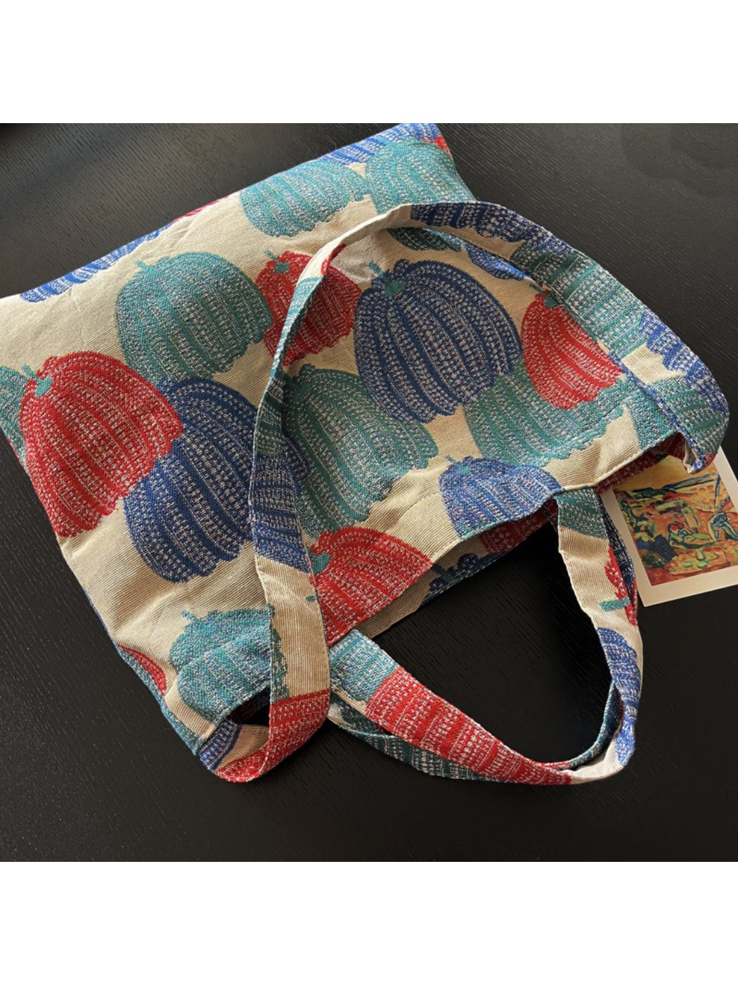 Side view of Cosbai vintage pumpkin shoulder tote showing smooth texture and strap