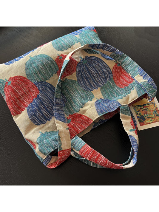 Side view of Cosbai vintage pumpkin shoulder tote showing smooth texture and strap