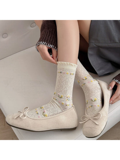 Rufia floral lace ankle socks styled with a summer outfit on a model