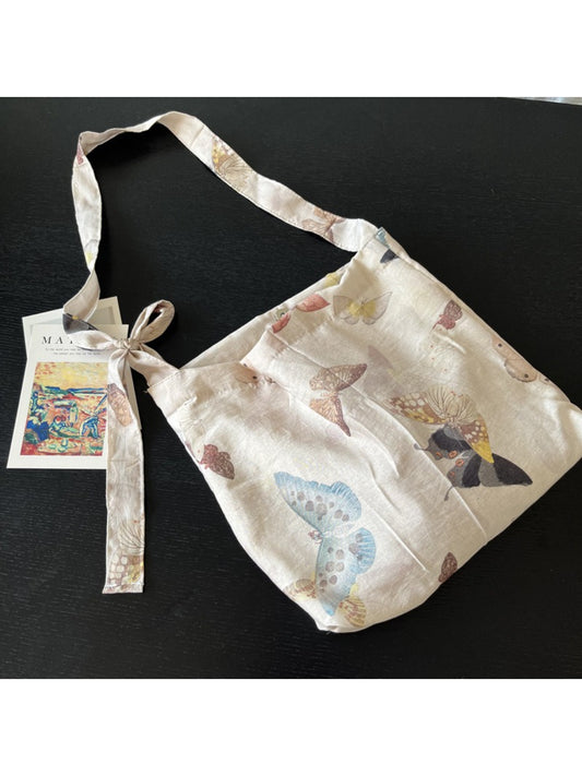 Cosbai butterfly print tie shoulder bag with a strap and vibrant colors