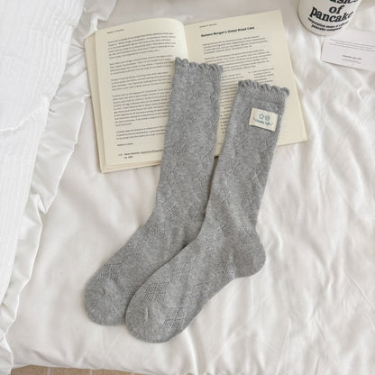 Close-up of the toe area of Rufia Fine Stripe Charm Crew Socks with stripe detail
