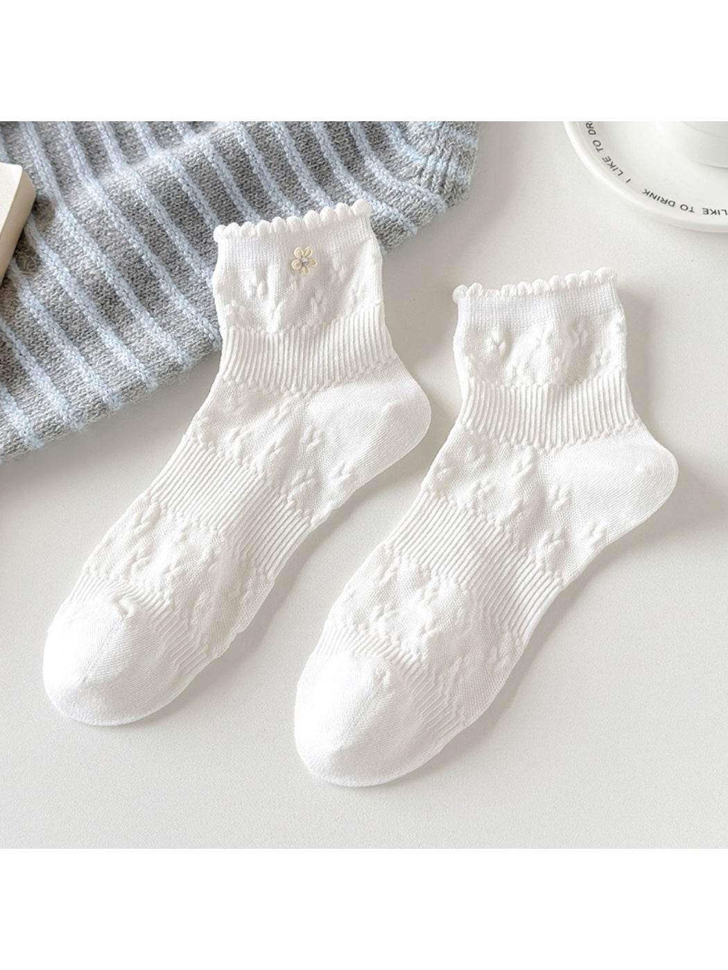 Side view of Rufia Sweet Floral Knit Crew Socks showing ribbed cuff