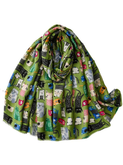 Detailed view of cat face sketches in bright colours on Scarvii scarf