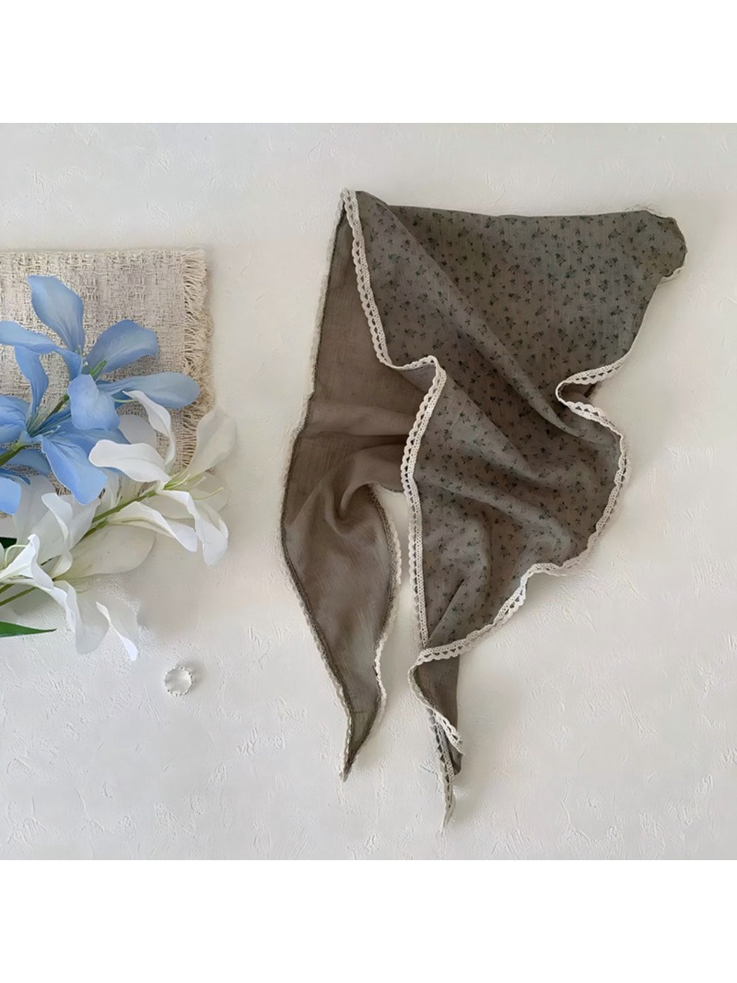 Scarvii ditsy floral lace tie headscarf styled as a neck accessory on a model