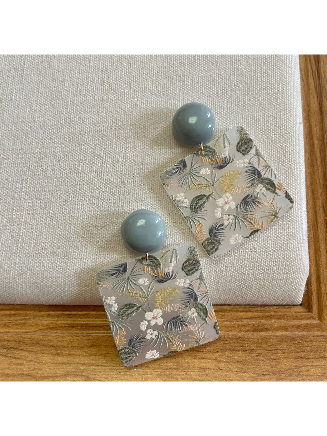 Close-up of Earwish Botanical Square Drop Earrings showing square botanical design
