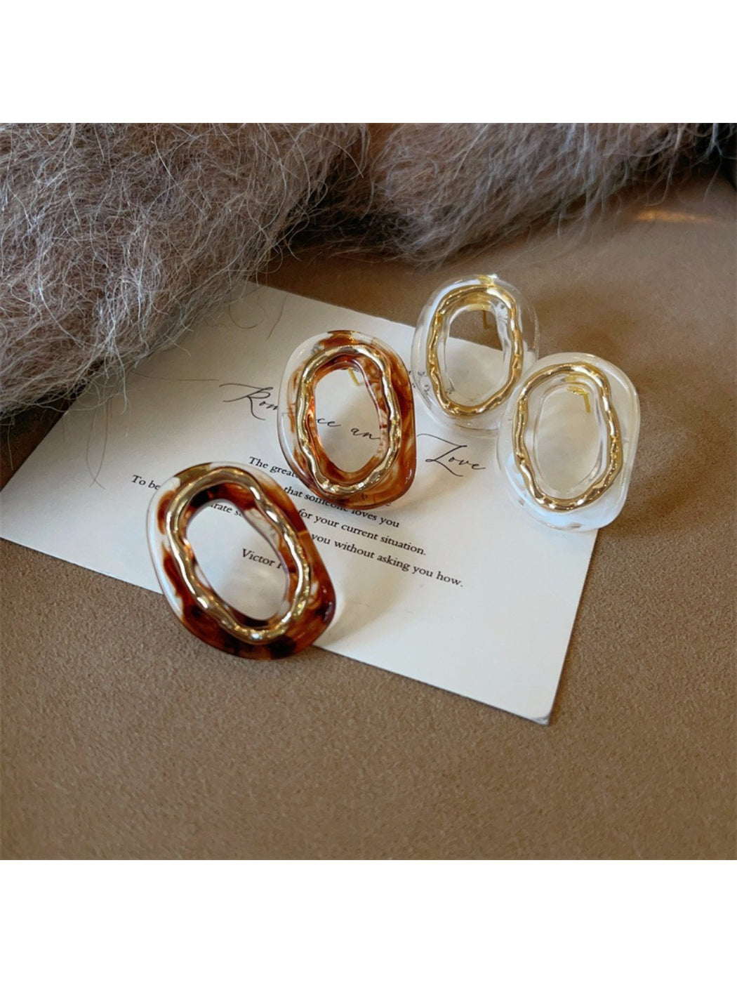Earwish modern sculpted oval earrings in polished silver finish on white background