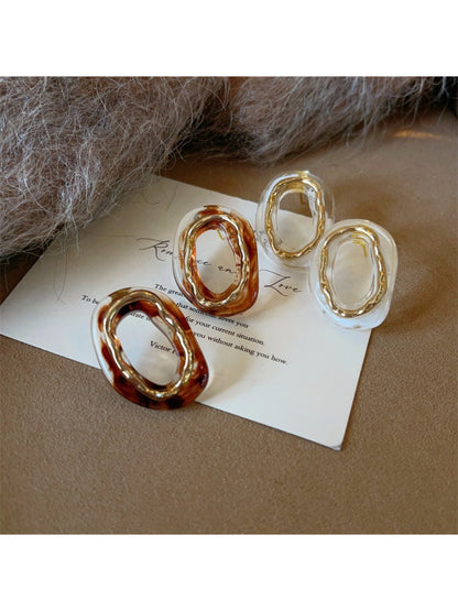 Earwish modern sculpted oval earrings in polished silver finish on white background