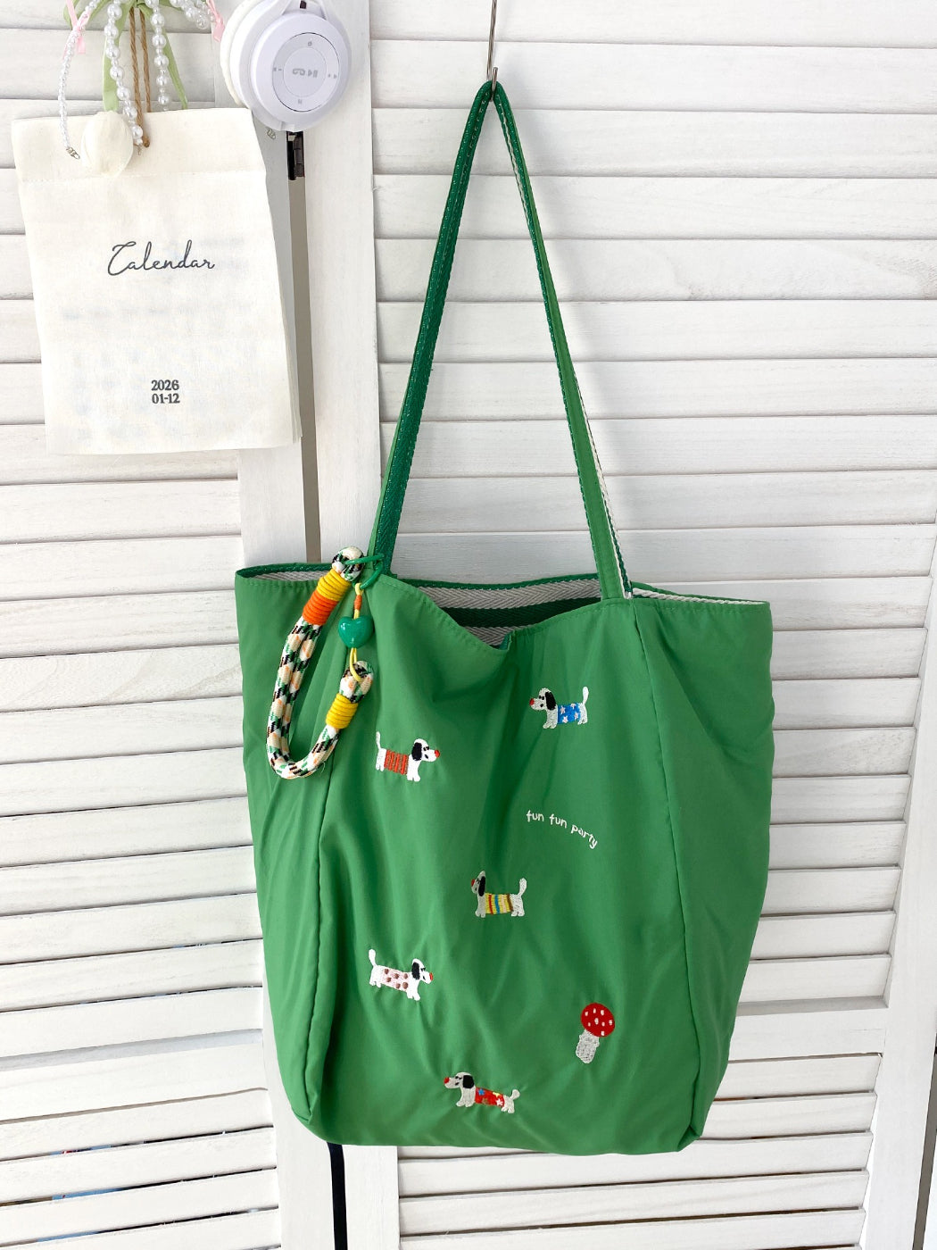 Cosbai tote bag shown from back, featuring continuous puppy print design