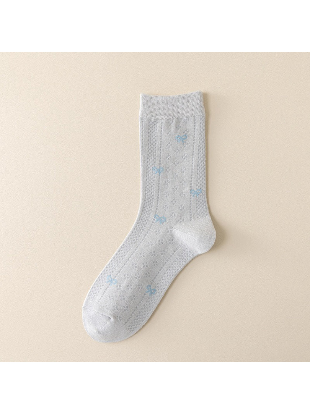 Rufia socks folded neatly with visible blue accent stripes