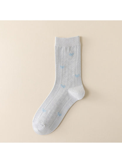 Rufia socks folded neatly with visible blue accent stripes