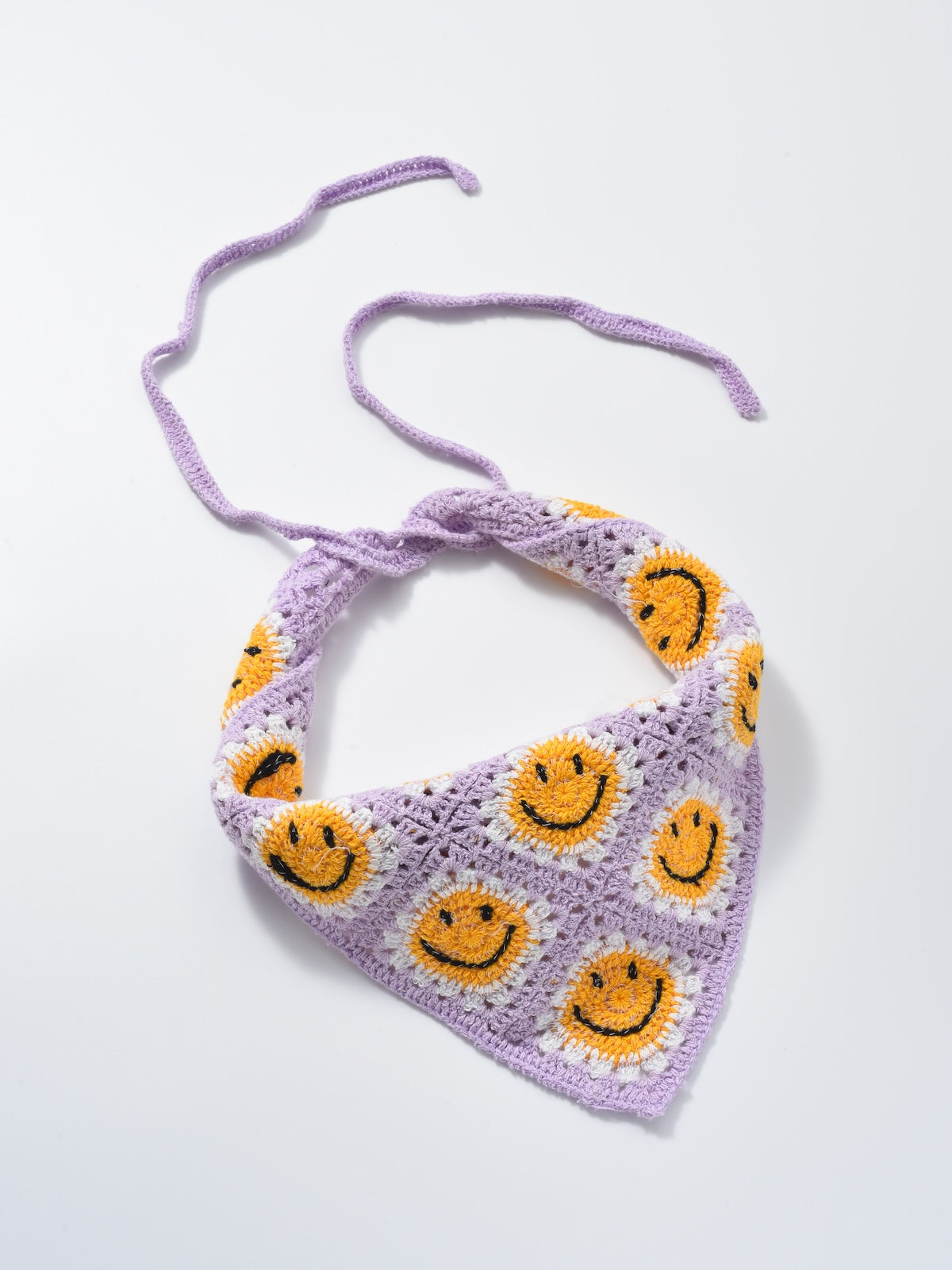 Scarvii crochet daisy smile hairband laid flat highlighting the daisy pattern
