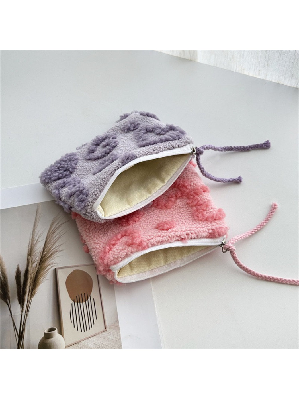 Close-up of the plush red heart gift pouch showing soft fabric texture