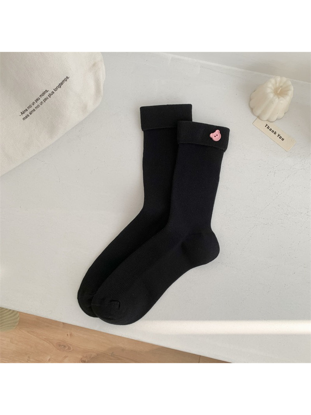 Side view of Rufia everyday crew socks with bold stripe pattern in various colors