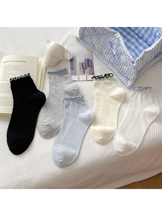 Pair of Rufia Simple Colour Edge Crew Socks in white with a red edge detail
