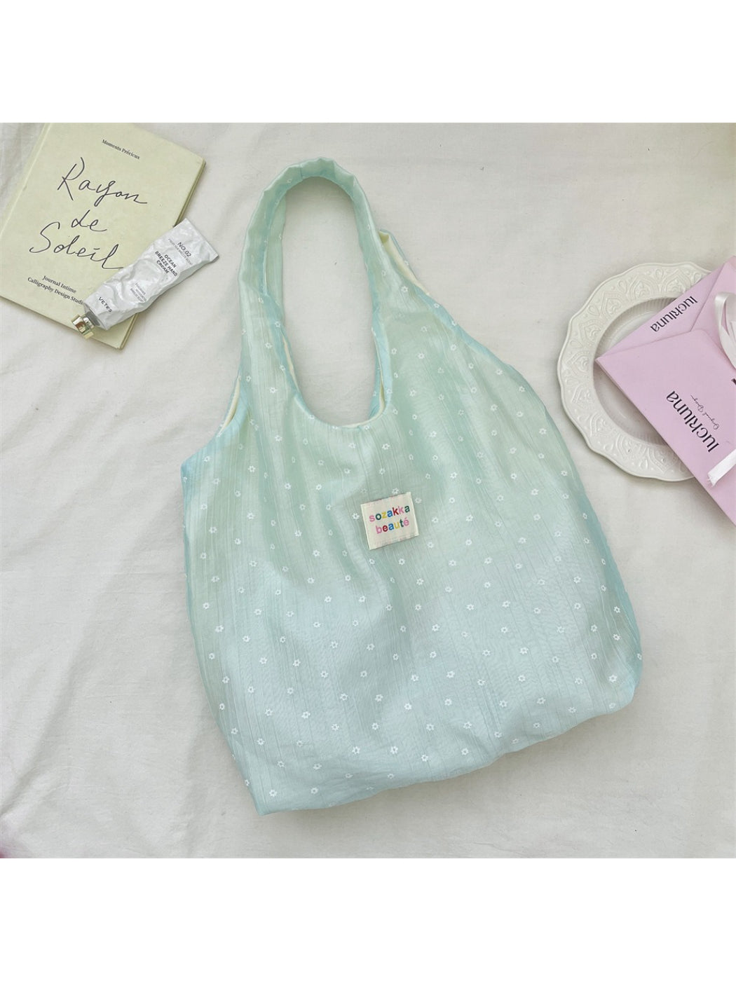 Cosbai Summer Bloom tote bag held by a model wearing casual summer outfit