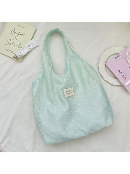 Cosbai Summer Bloom tote bag held by a model wearing casual summer outfit